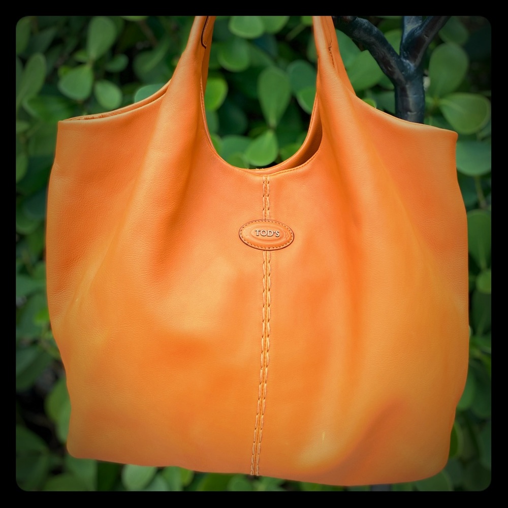 Orange leather Tod’s tote.